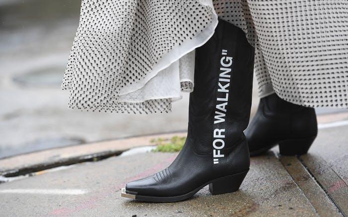 street style spring summer 2019 new york fashion week usa 10 sep 2018 nyfw ss19 alone female not-personality 74422054 clothing apparel footwear riding boot boot