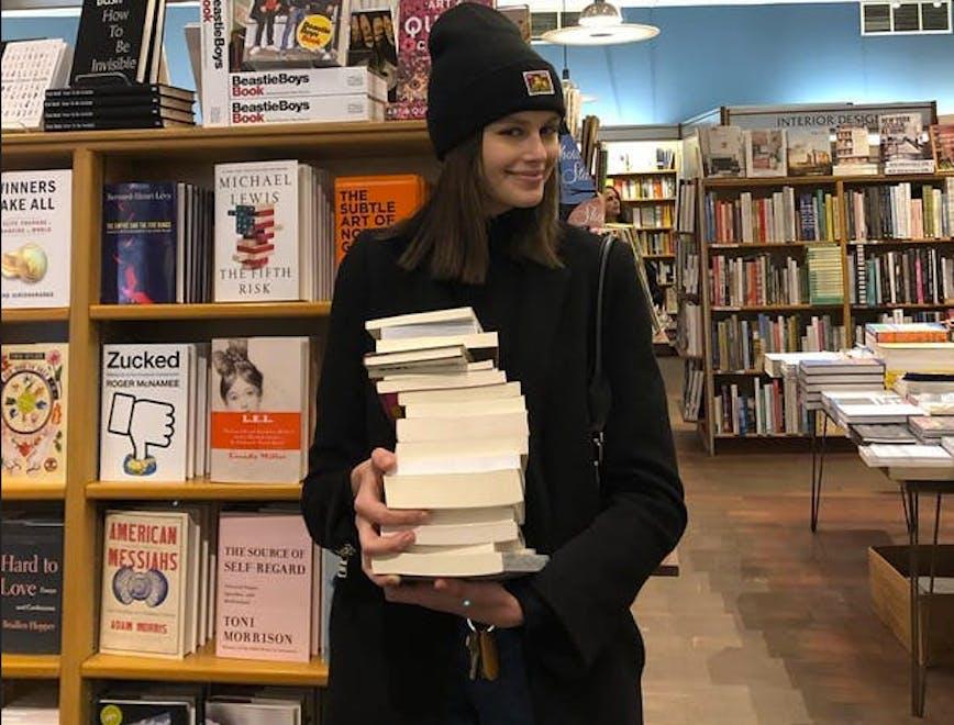 indoors shop book bookstore room person human library