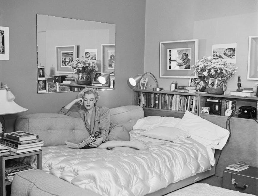 j166182405,neg 13363 a,barefoot,book,diry 18158,indoors,living r book furniture bedroom room indoors bed person human interior design living room