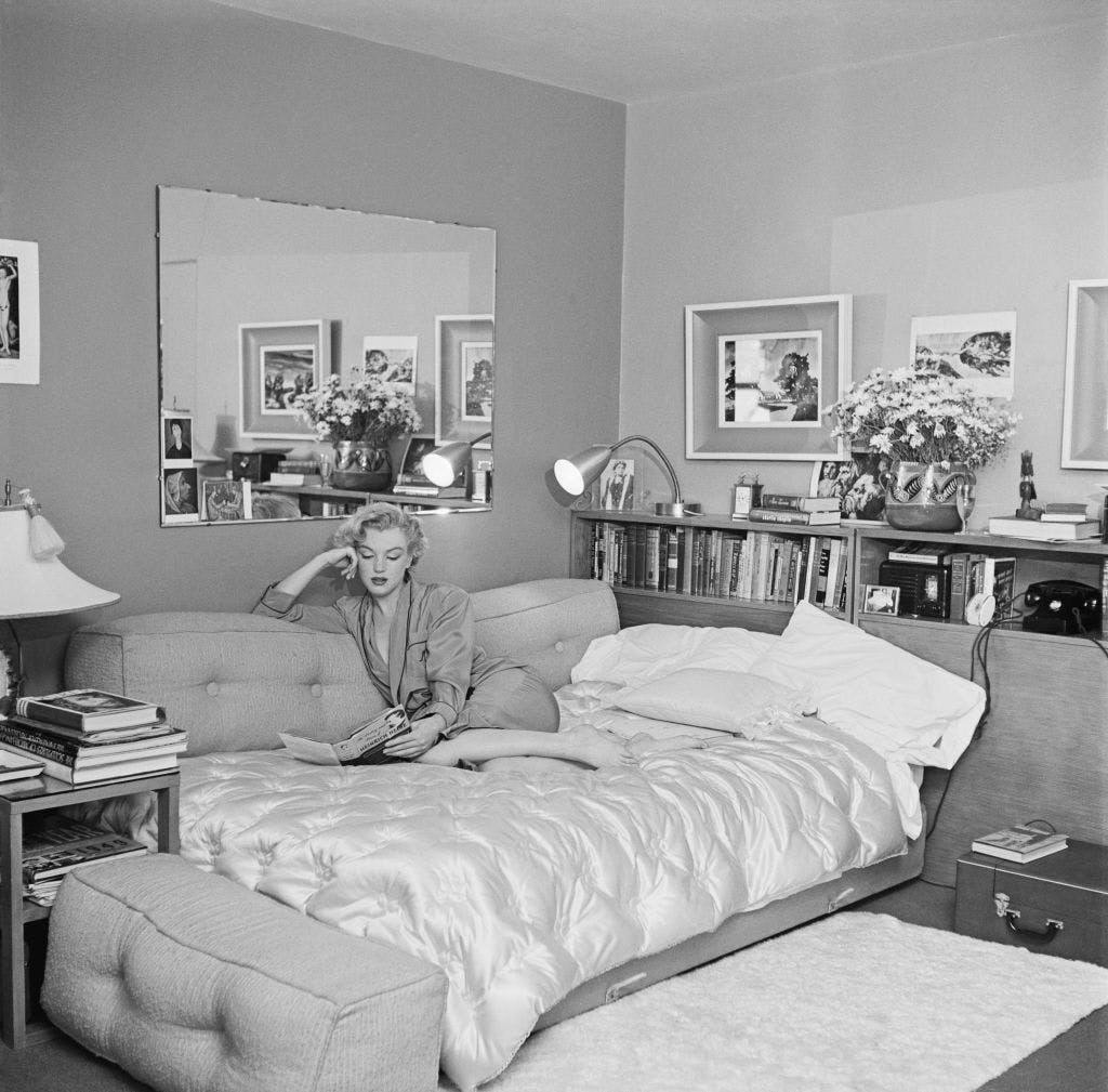 j166182405,neg 13363 a,barefoot,book,diry 18158,indoors,living r book furniture bedroom room indoors bed person human interior design living room