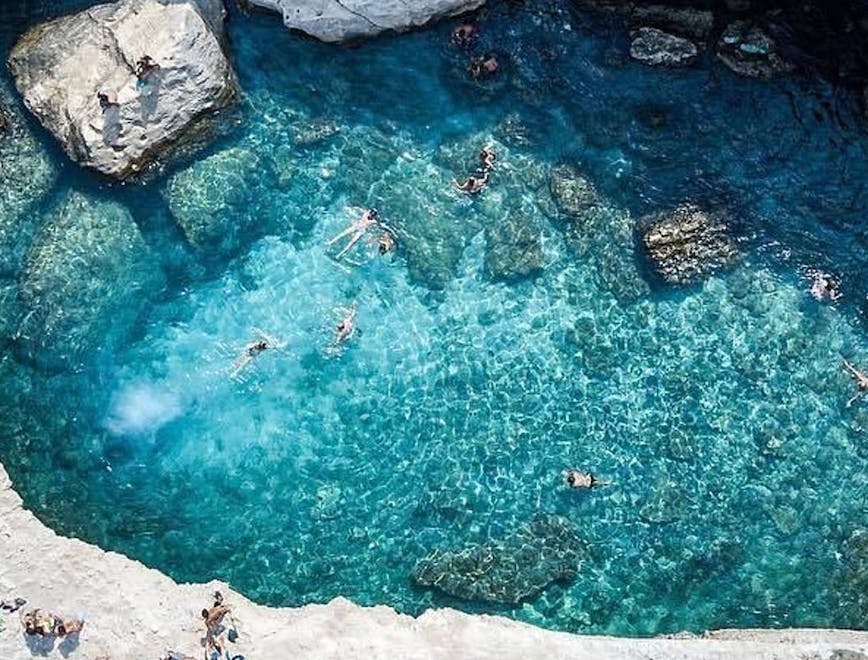 rock water lagoon nature outdoors lake sea swimming person landscape