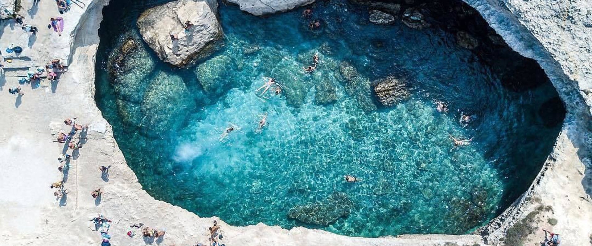 rock water lagoon nature outdoors lake sea swimming person landscape