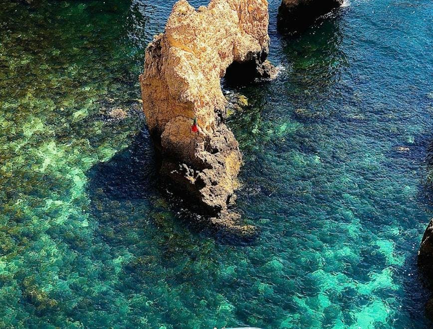 promontory nature water outdoors boat sea shoreline cliff coast rock