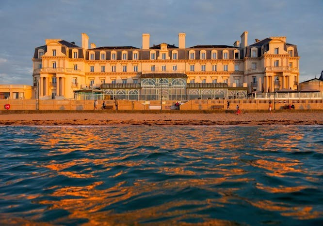 water building person human waterfront outdoors architecture