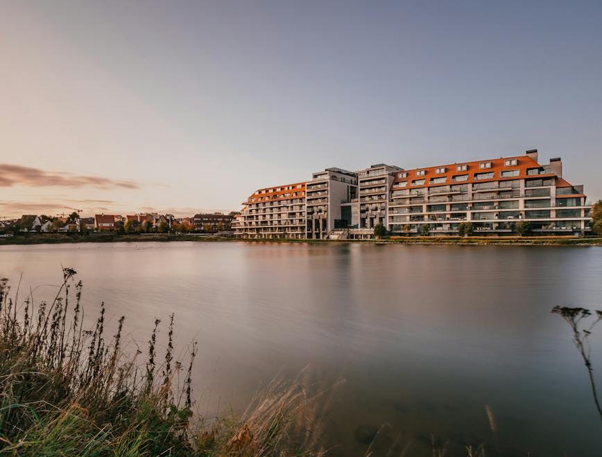 water grass plant outdoors office building building nature waterfront