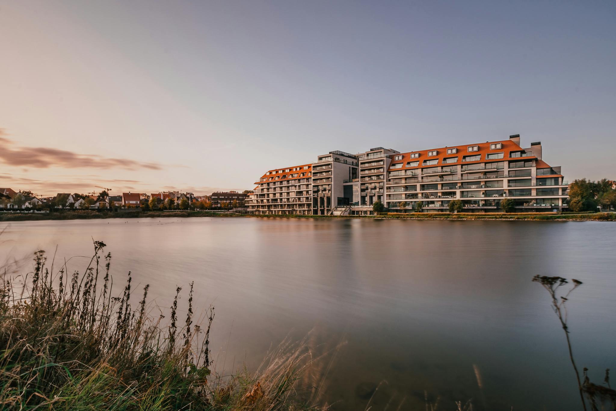 water grass plant outdoors office building building nature waterfront