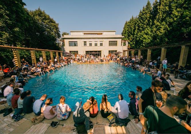 person human building water hotel resort pool