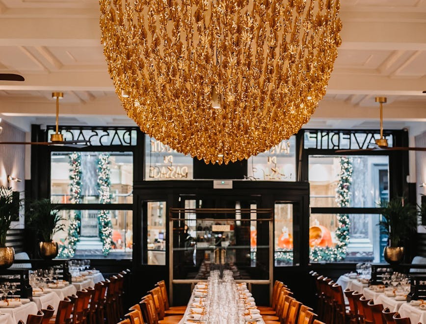 chandelier lamp indoors restaurant chair furniture aisle