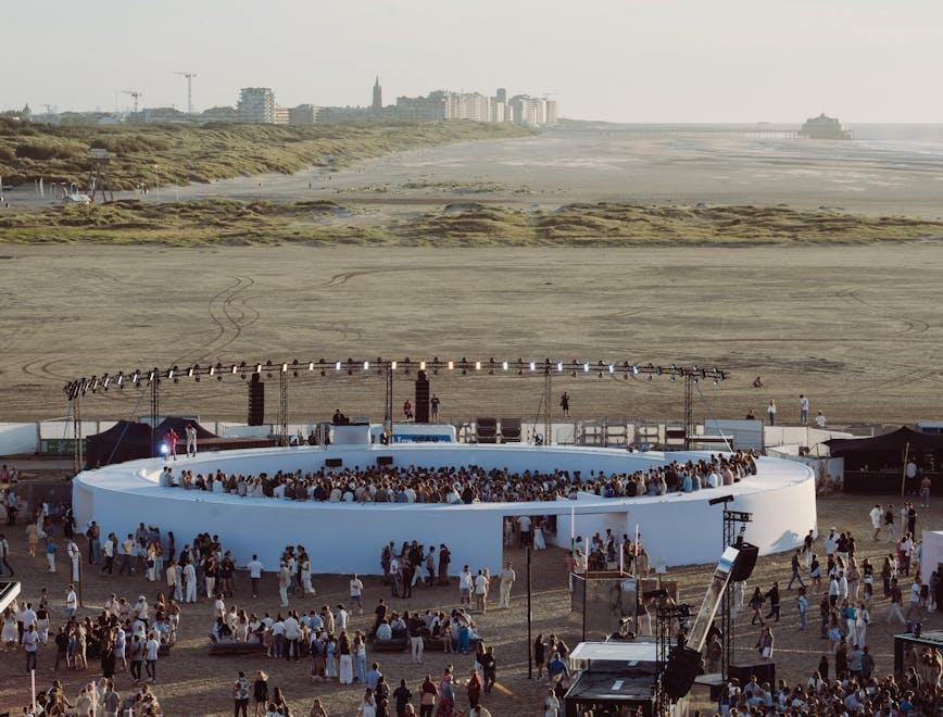 water waterfront concert crowd person city people construction construction crane