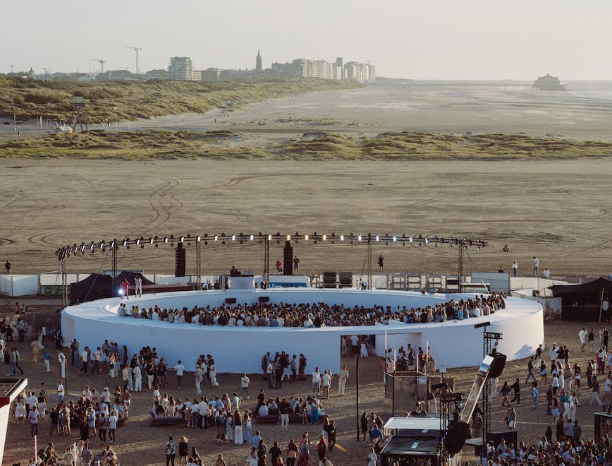 water waterfront concert crowd person city people construction construction crane