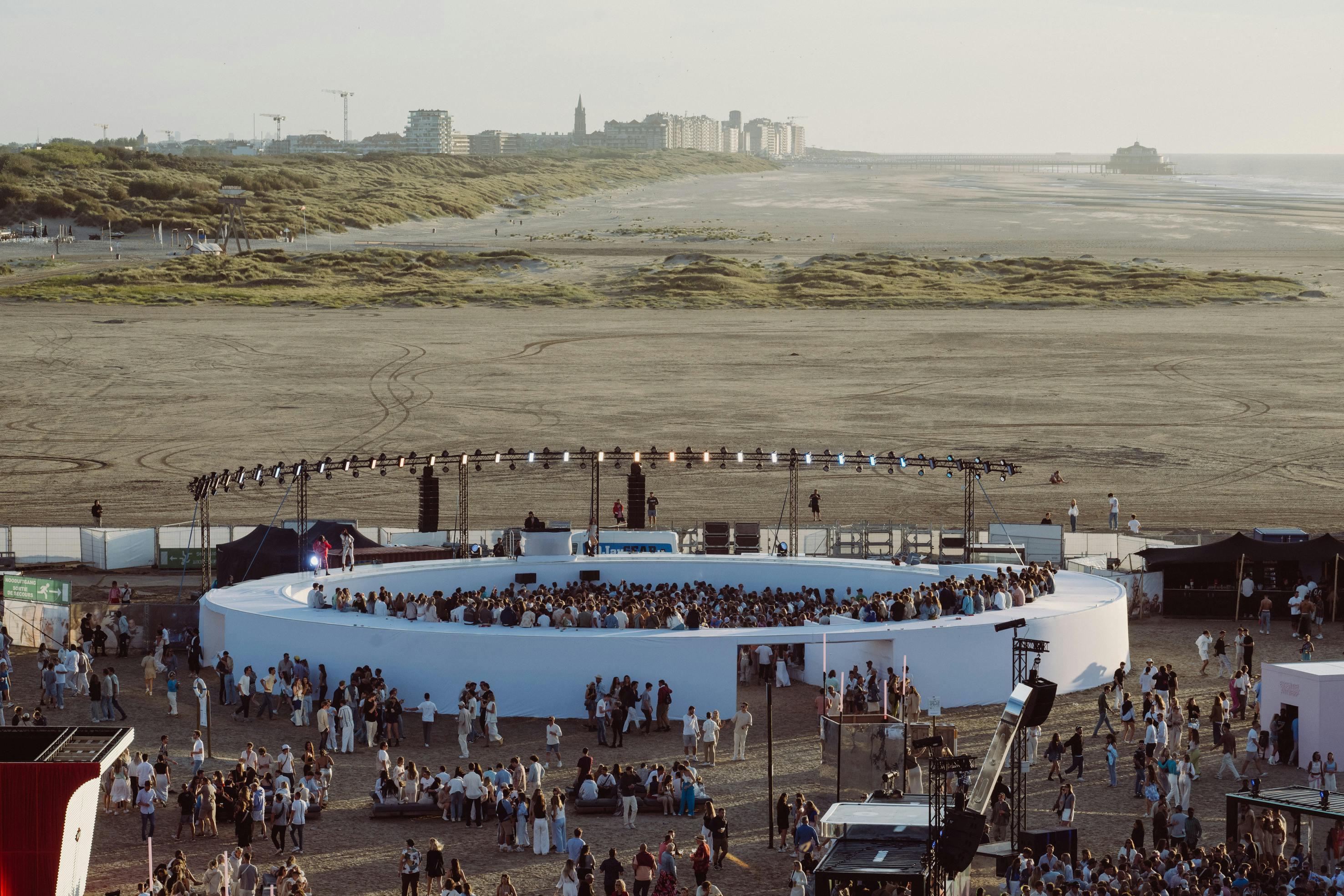 water waterfront concert crowd person city people construction construction crane