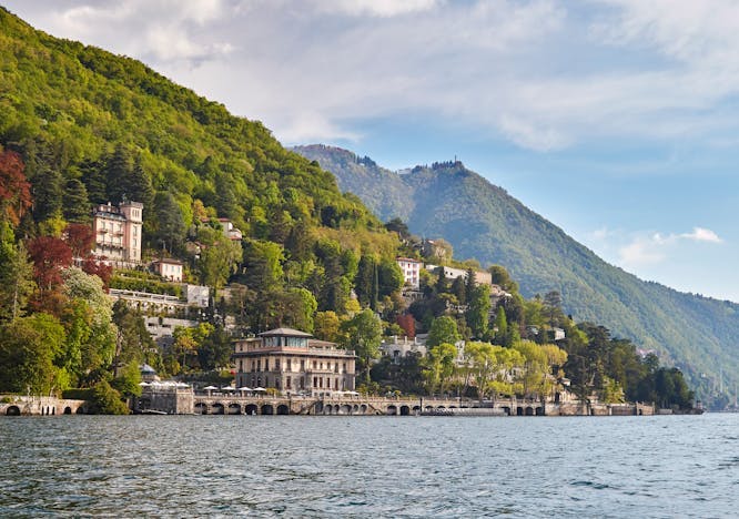 emea lake como nature outdoors scenery water waterfront lake fir tree promontory building